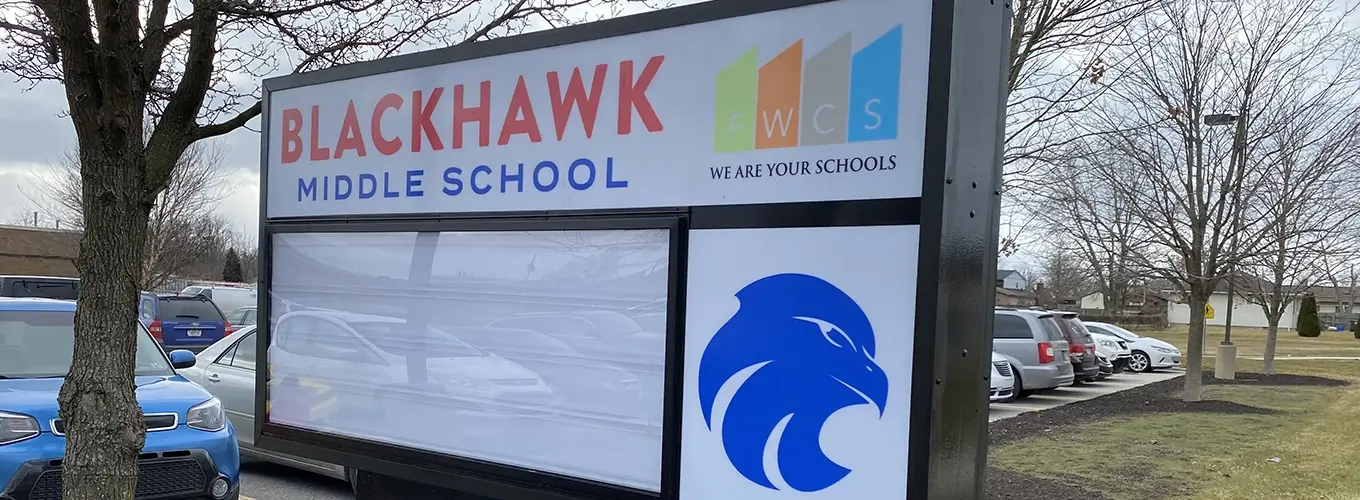 A daylight photo of a monument sign for Blackhawk Middle School. 